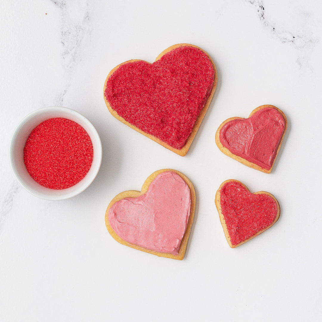 Valentine's Heart Cookies decorated with natural red food coloring and dye free red sanding sugar.